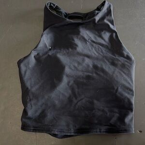 alo yoga top Size “M” beautiful condition. Laced back. Nylon elasthanne
